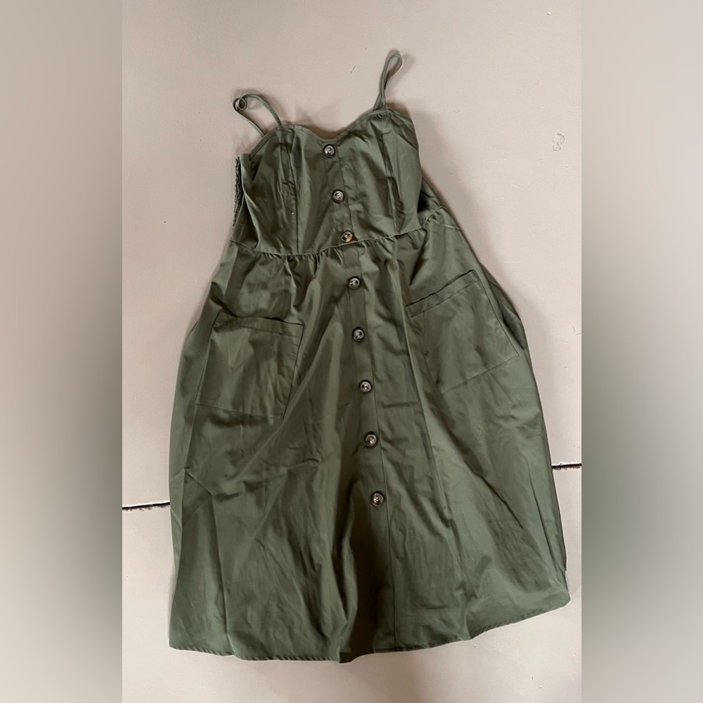Olive green spaghetti strap maxi dress with brown buttons and pockets
